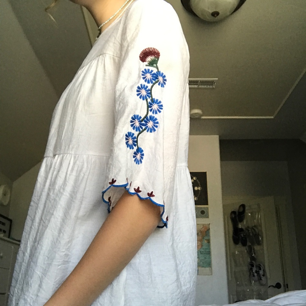 flowy white top with embroidered sleeves!